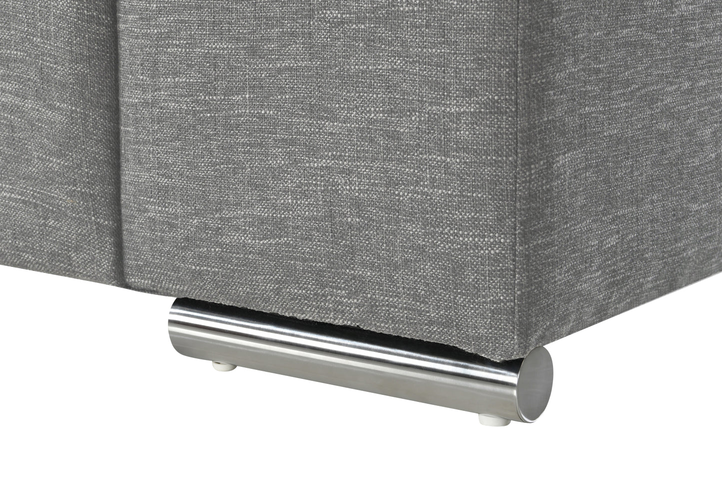 Closeup of a grey fabric couch with a modern chrome leg detail