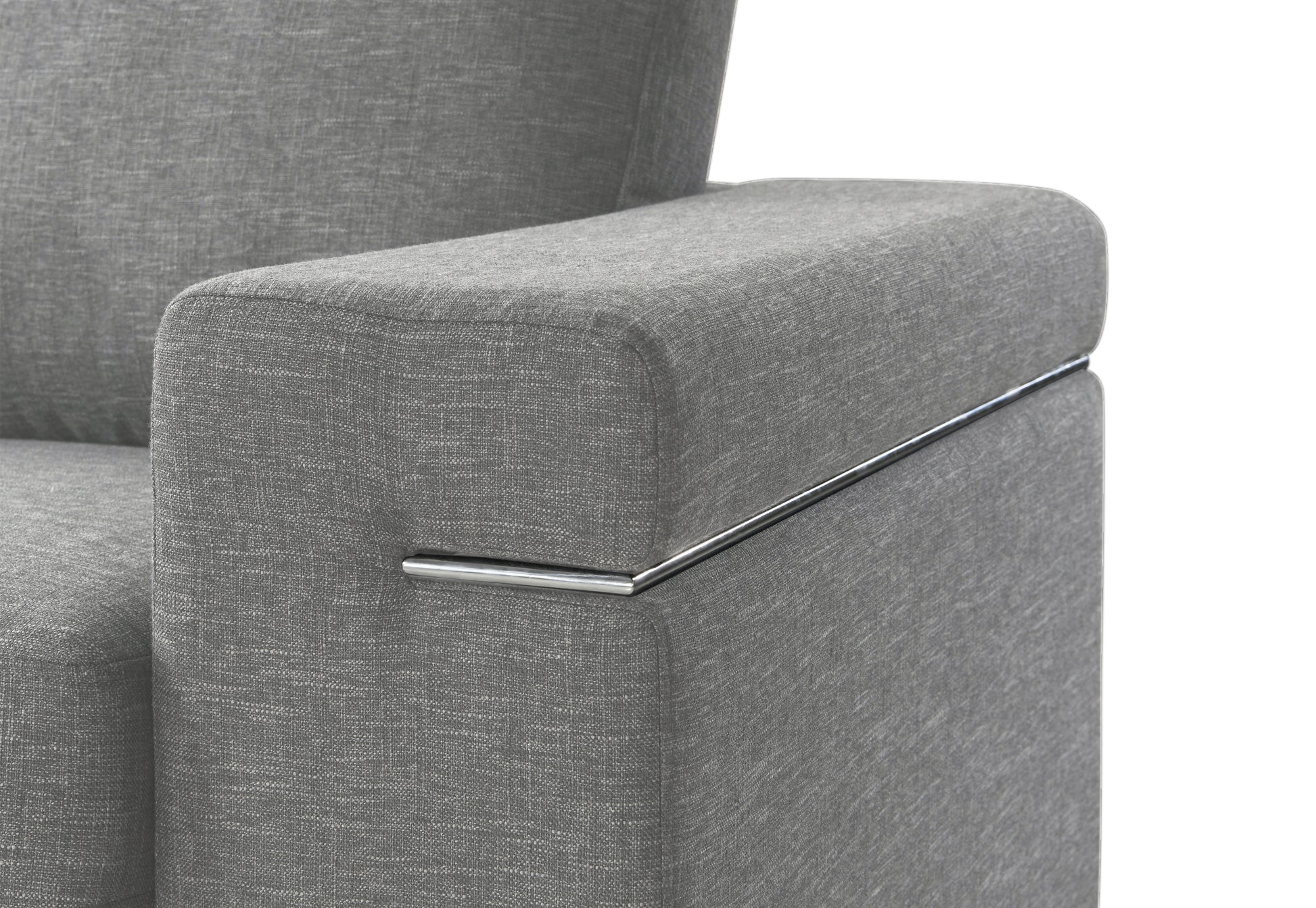 Closeup of a grey textured fabric sofa armrest with a polished chrome accent strip