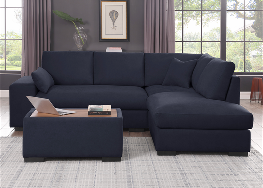 Deep navy blue velvet sectional sofa with plush cushions and modern design