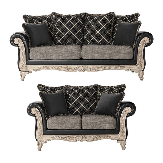 Elegant ornate twoseater sofa with black leather and patterned cushions