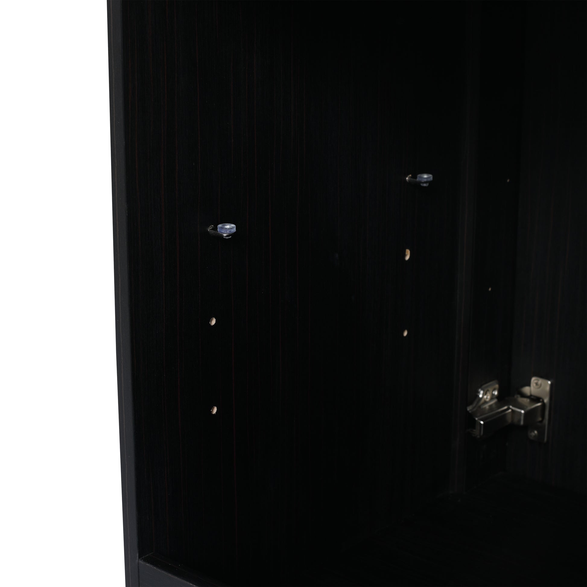 Dark wood cabinet interior with visible shelf pegs and a cabinet hinge