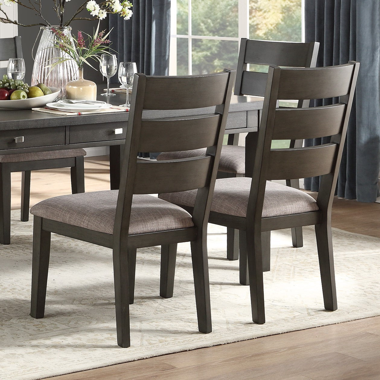 Dark gray wooden dining chairs with upholstered seats