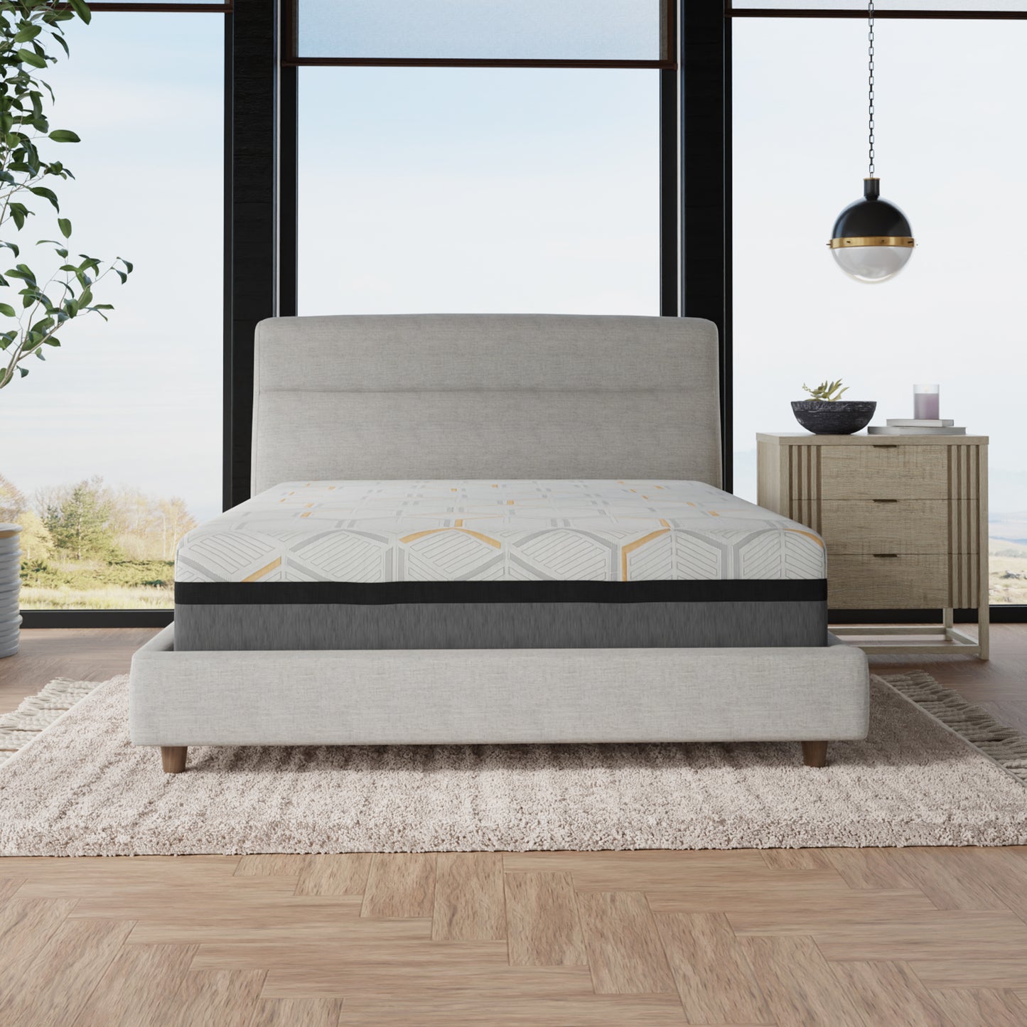 Queen size memory foam mattress with geometric gray and yellow pattern on a light gray bed frame