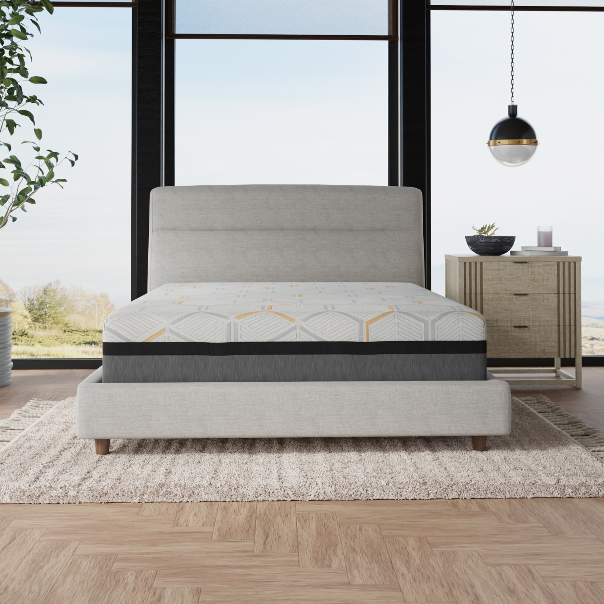 Queen size memory foam mattress with geometric gray and yellow pattern on a light gray bed frame