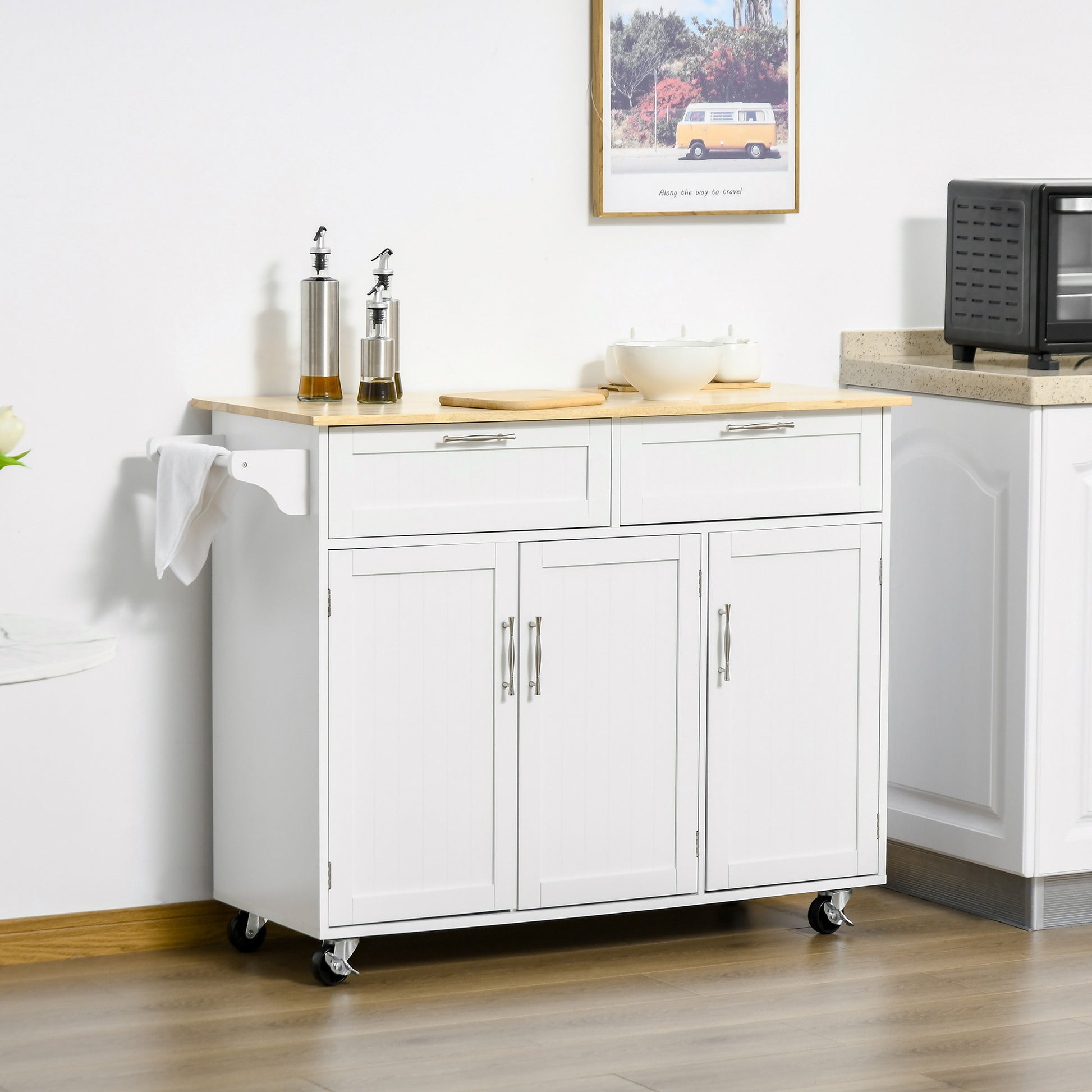 White kitchen island cart with wooden top and silver handles on wheels