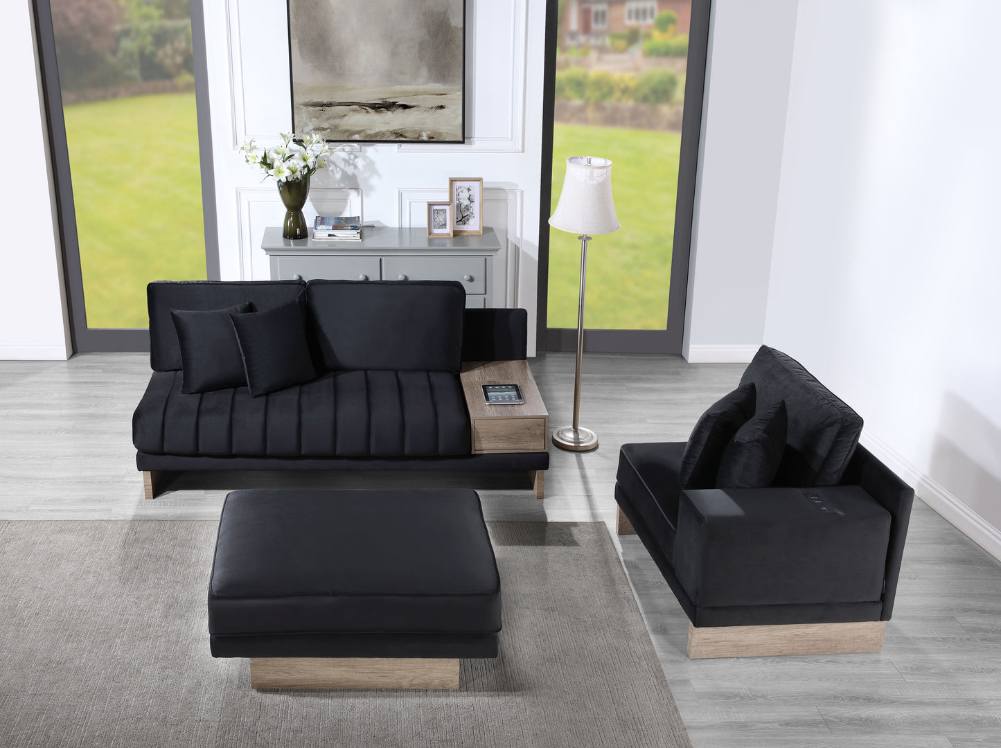 Sleek black velvet sofa with tufted cushions and integrated woodtone side table ideal for modern living rooms