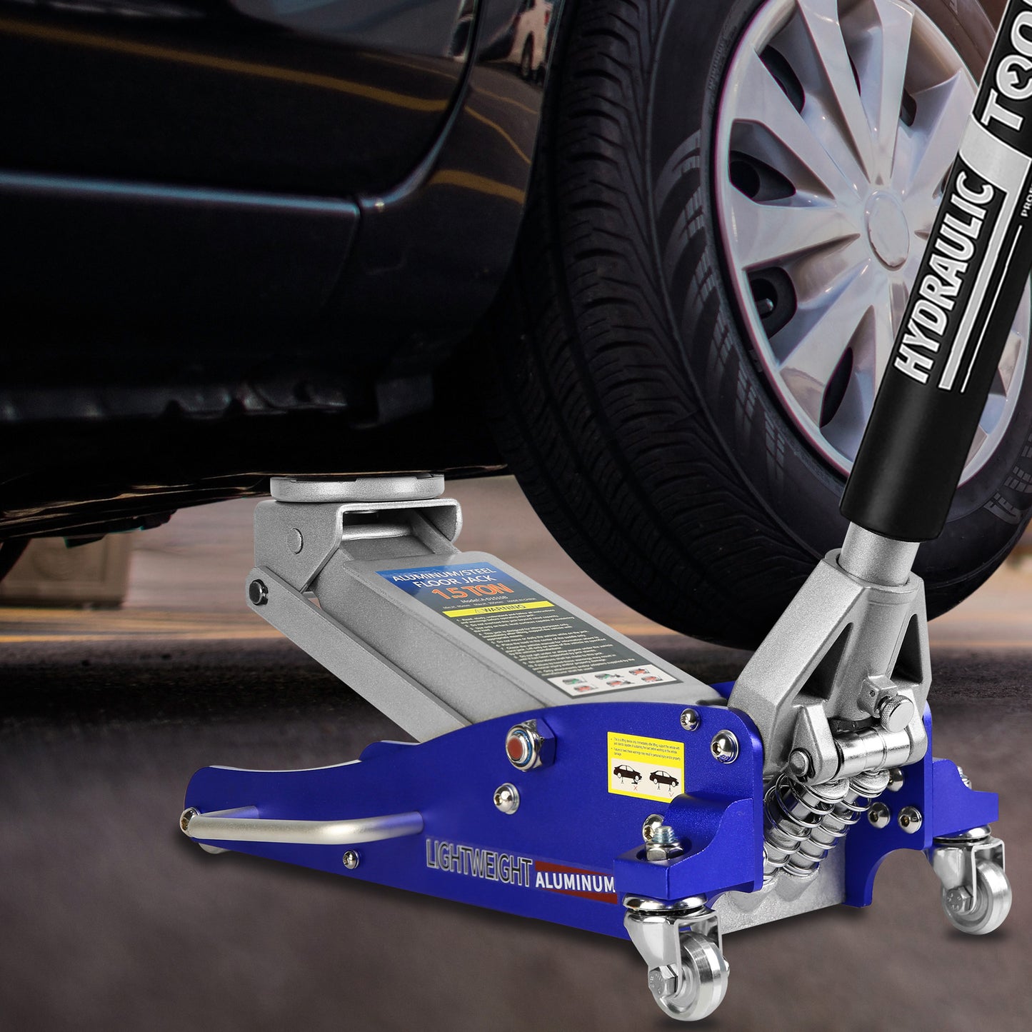 Blue aluminum floor jack lifting a car for tire change