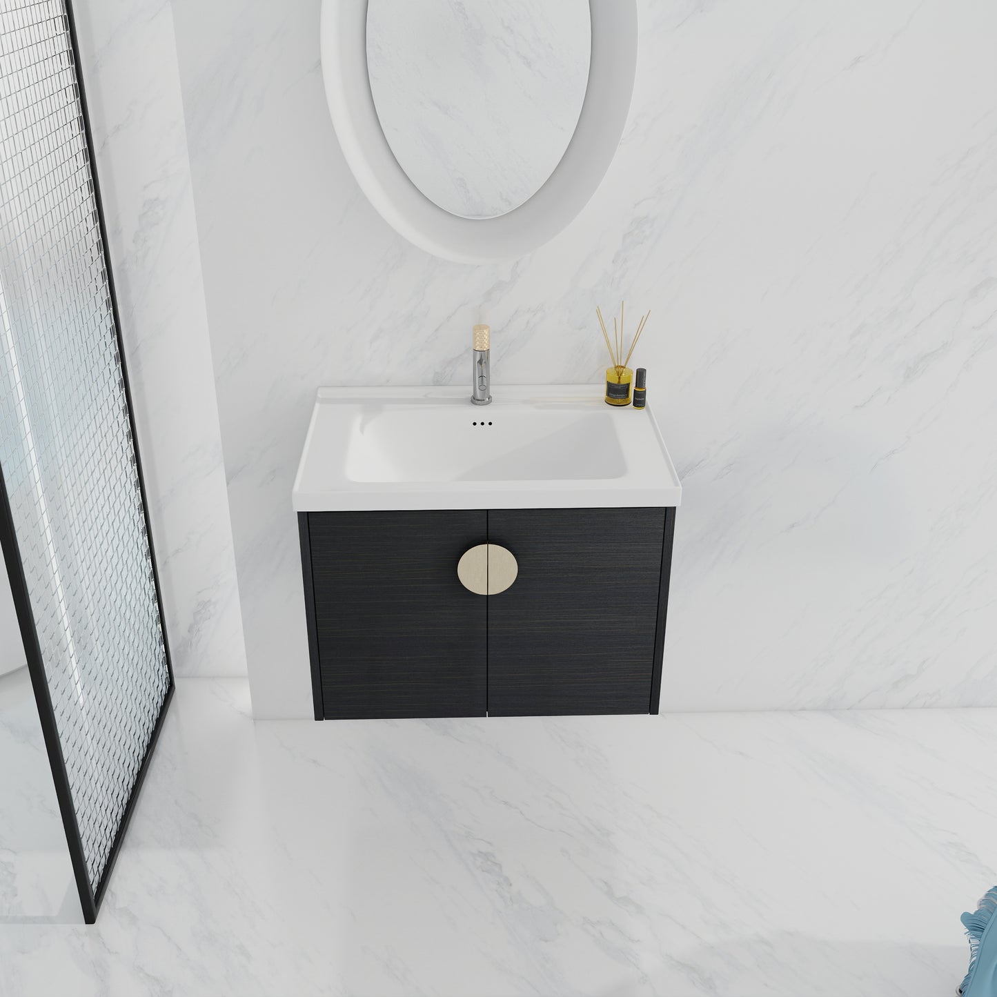 Modern black wood bathroom vanity with a circular brass handle and white basin