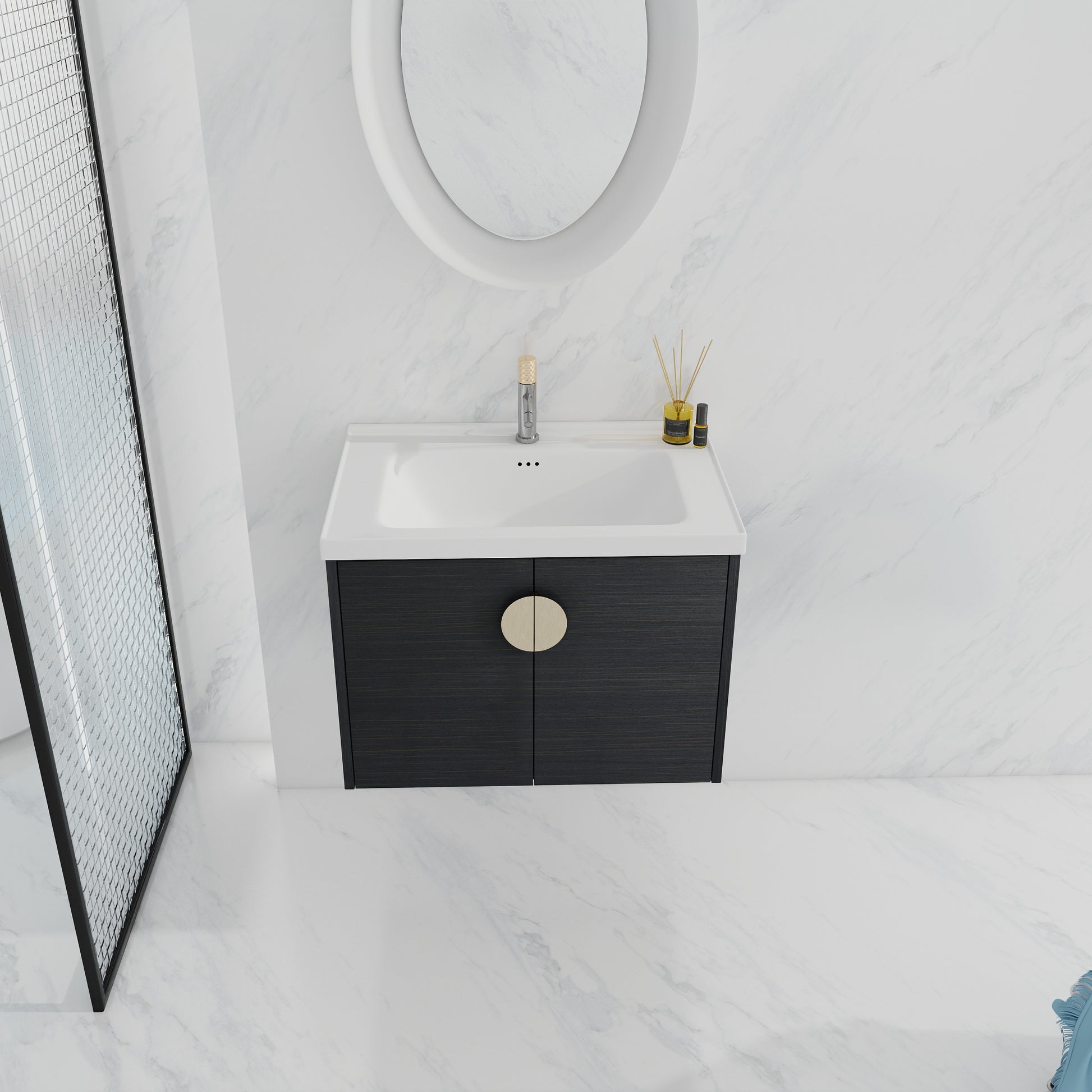 Modern black wood bathroom vanity with a circular brass handle and white basin