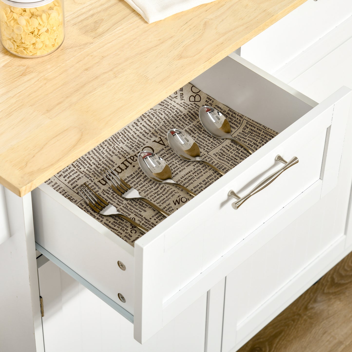 Stainless steel cutlery set in an open drawer