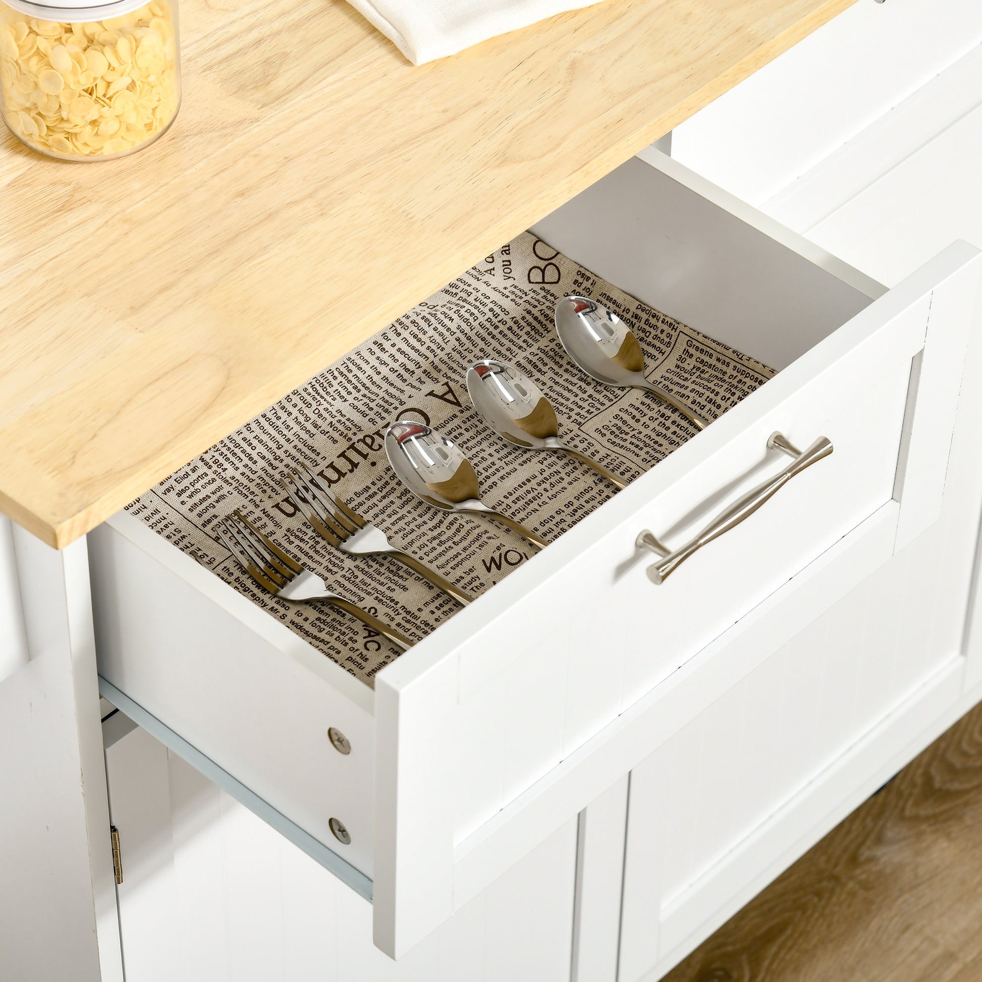 Stainless steel cutlery set in an open drawer