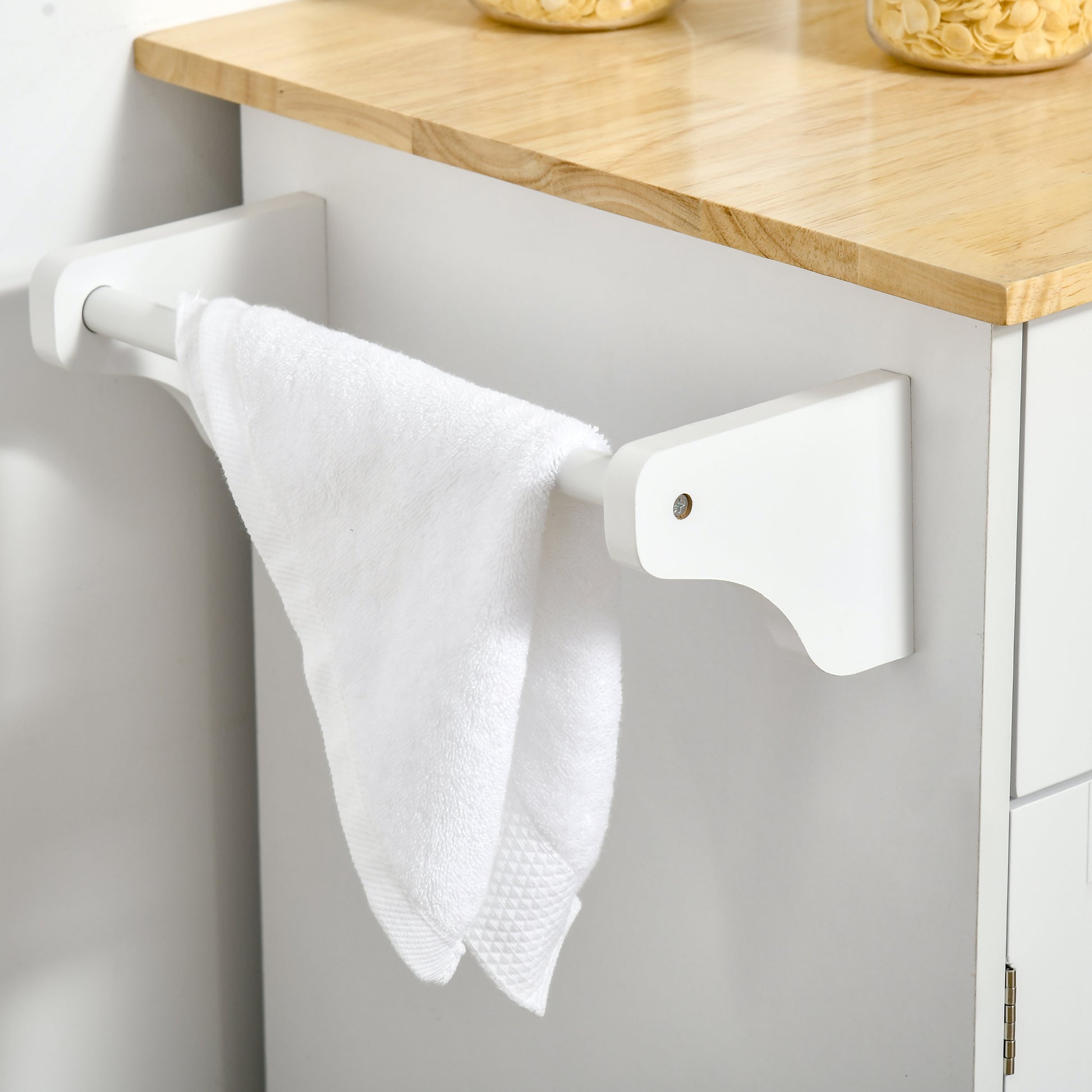 White kitchen cart with wooden top and towel rack