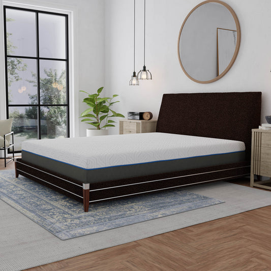 White and grey patterned memory foam mattress with blue trim on dark platform bed