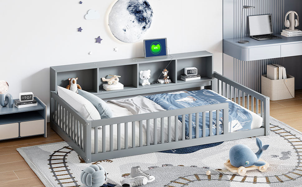 Grey wooden toddler bed with storage bookshelf and whalethemed bedding