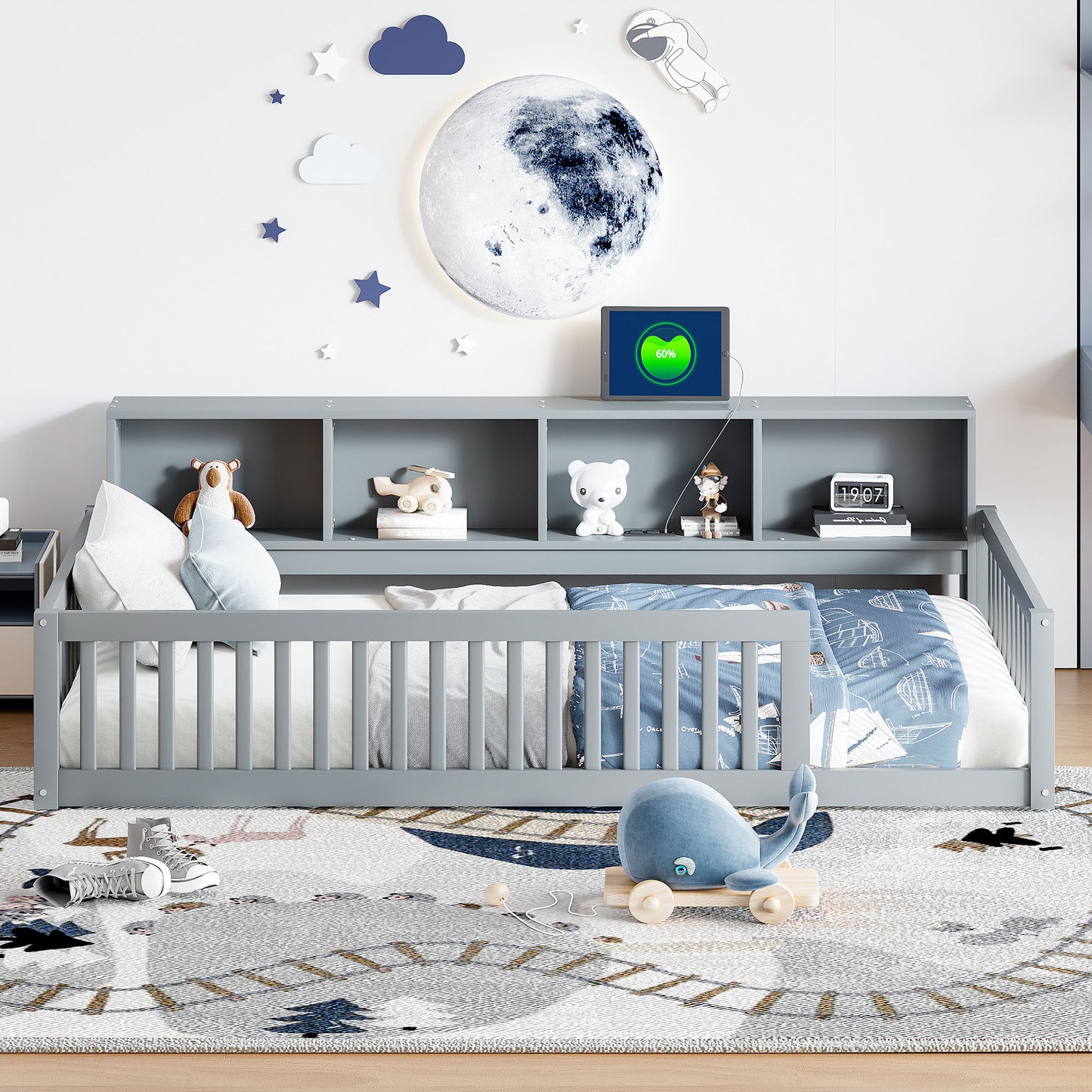 Gray toddler bed with shelves and playful astronaut and moon wall decor