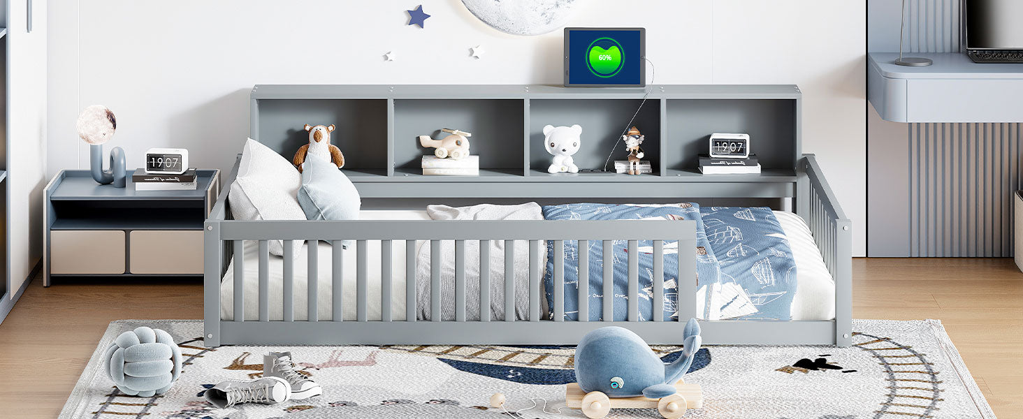 Gray wooden toddler bed with nautical print bedding and stuffed whale toy