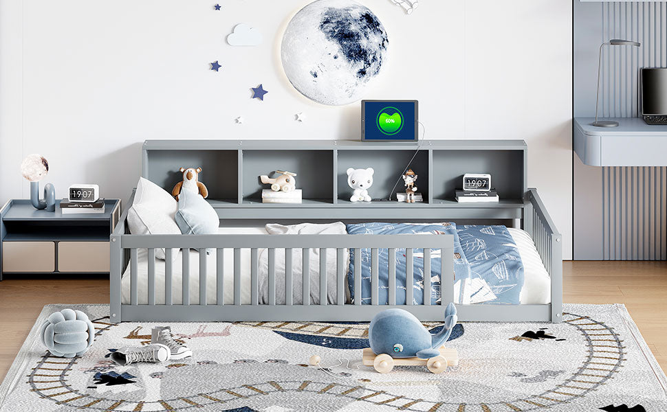Gray toddler bed with builtin bookshelves and playful bedding