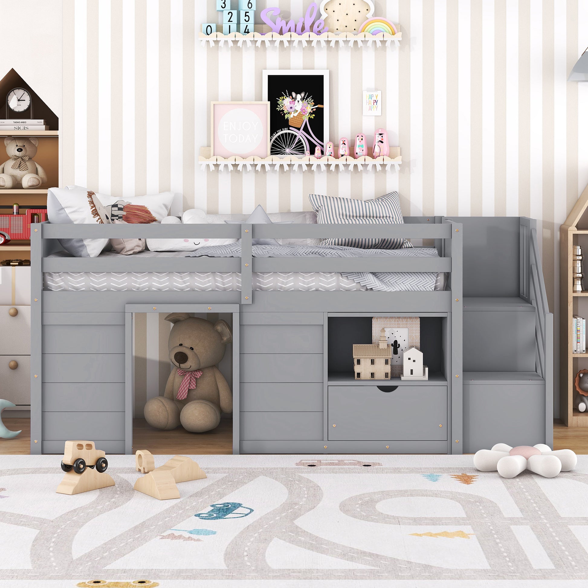 Gray loft bed with staircase and builtin cubbies for kids