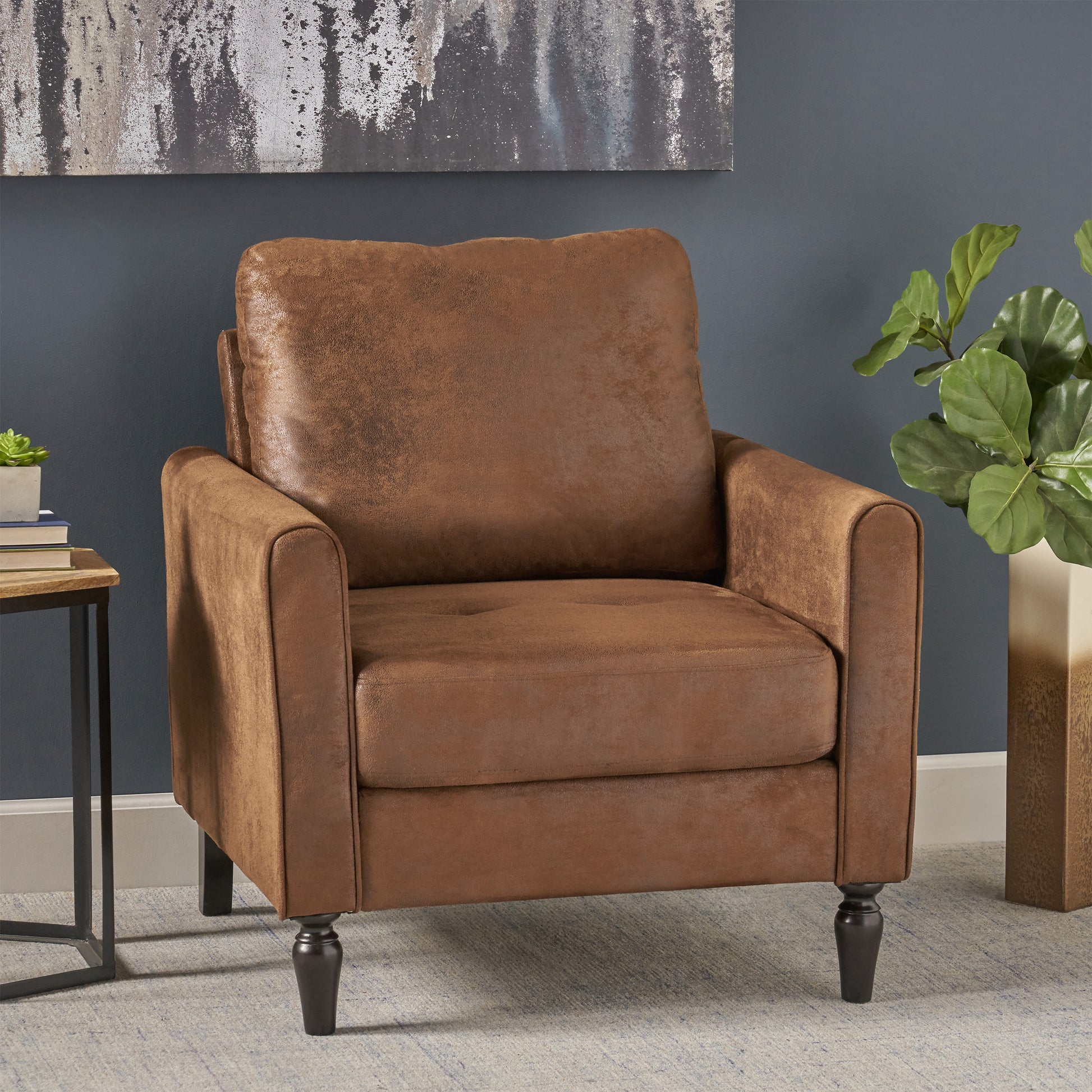 Brown faux leather armchair with plush cushions tufted seat and dark tapered legs