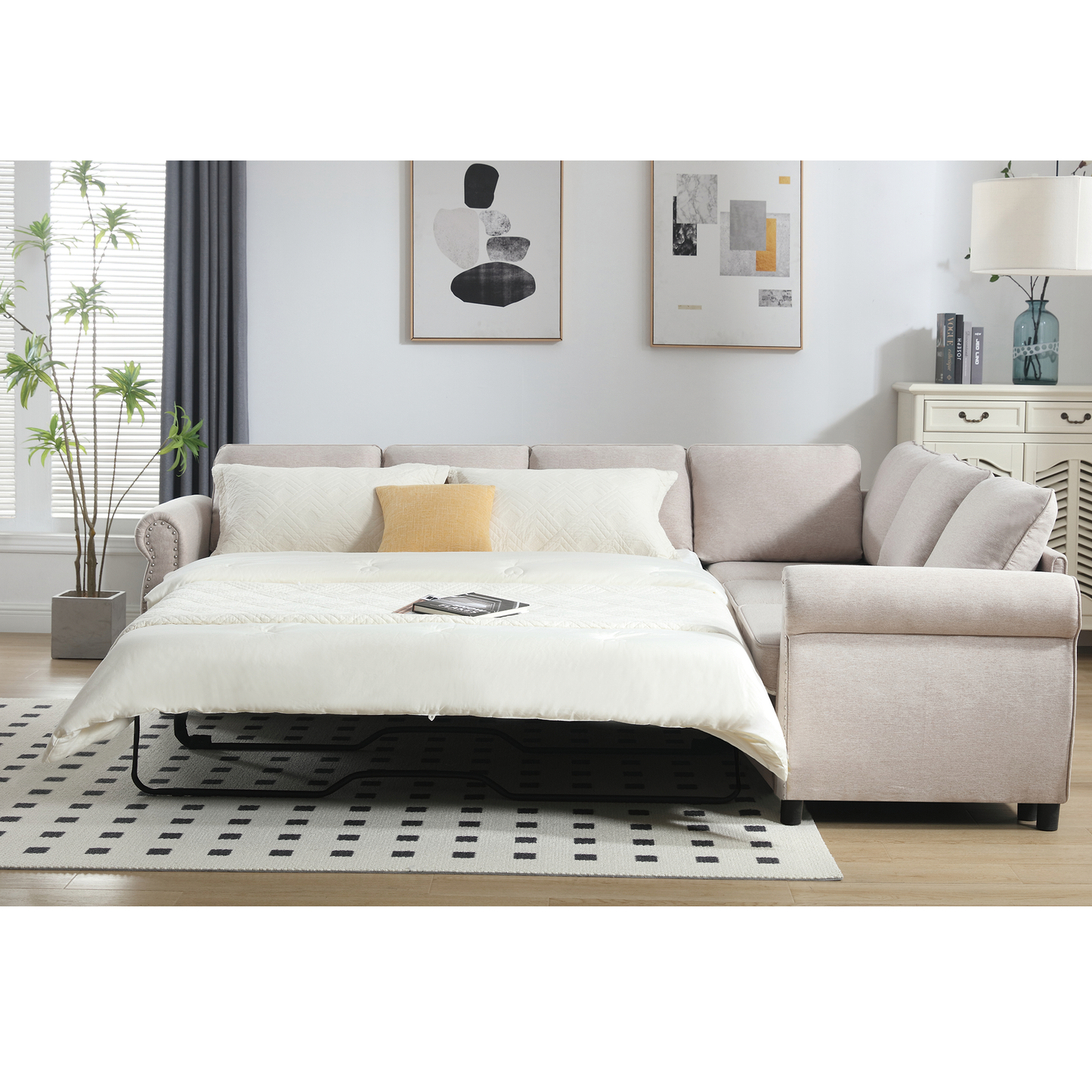Beige linen sectional sofa bed with white bedding and throw pillows