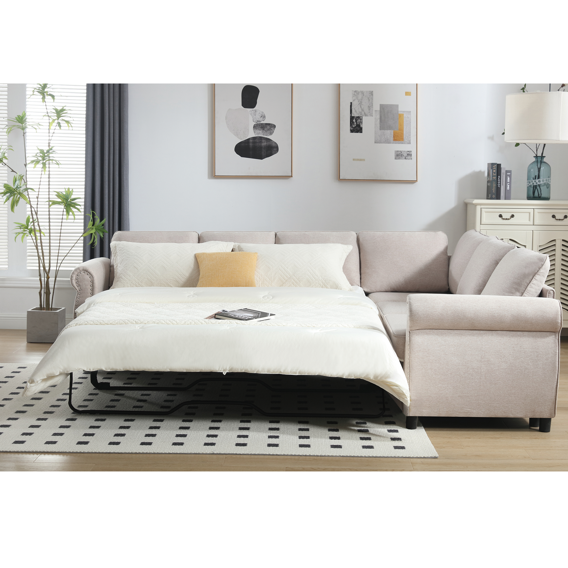 Beige linen sectional sofa bed with white bedding and throw pillows