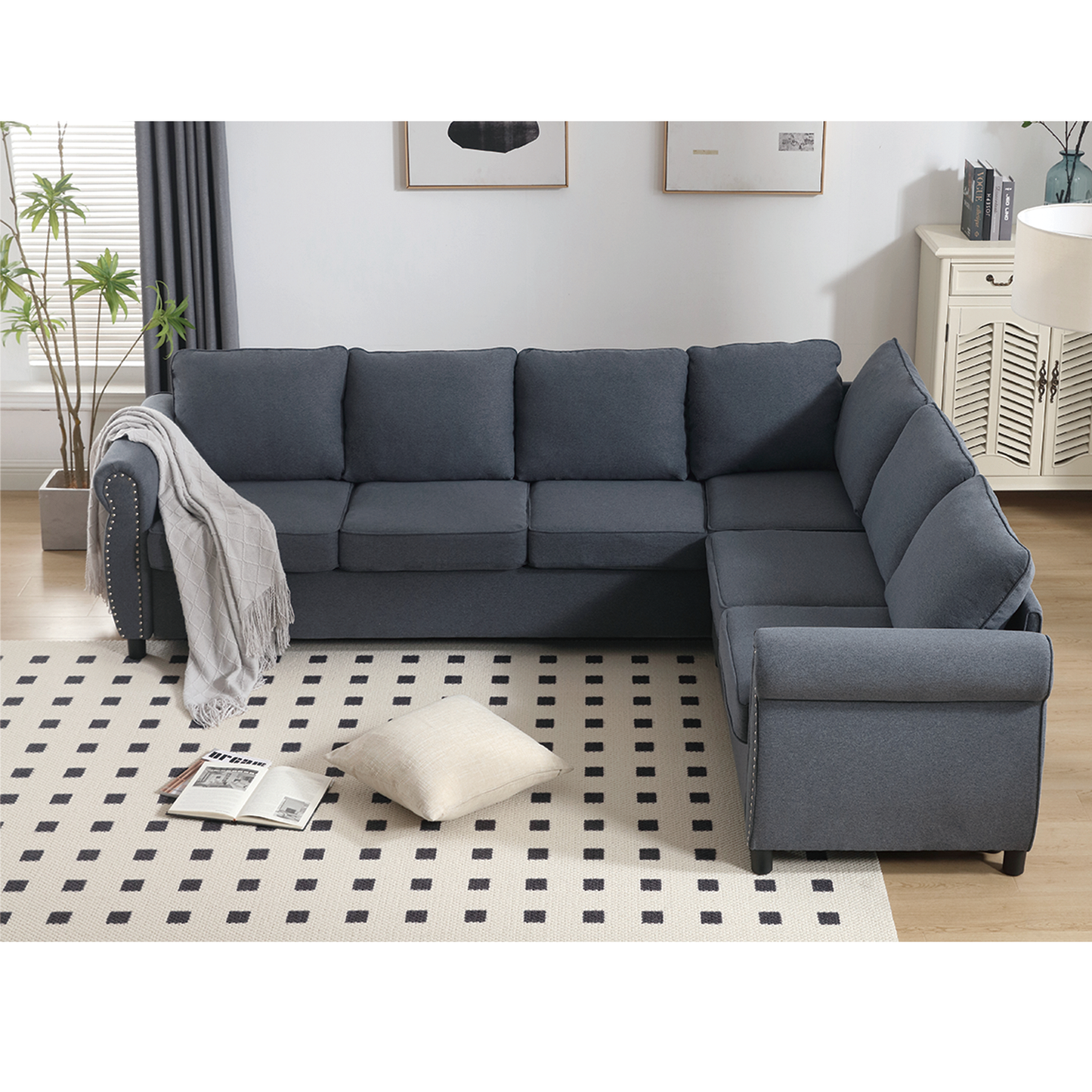 Modern dark gray fabric sectional sofa with studded armrest perfect for living room seating