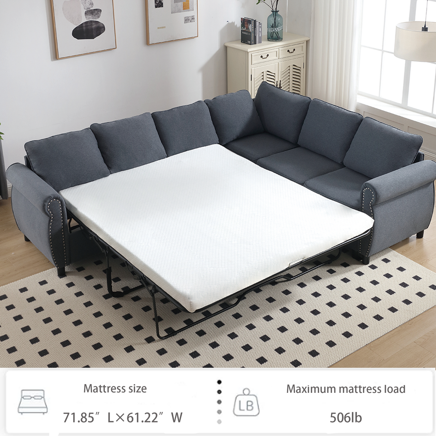 Dark grey sectional sofa bed with a queensize mattress unfolded featuring studded arms