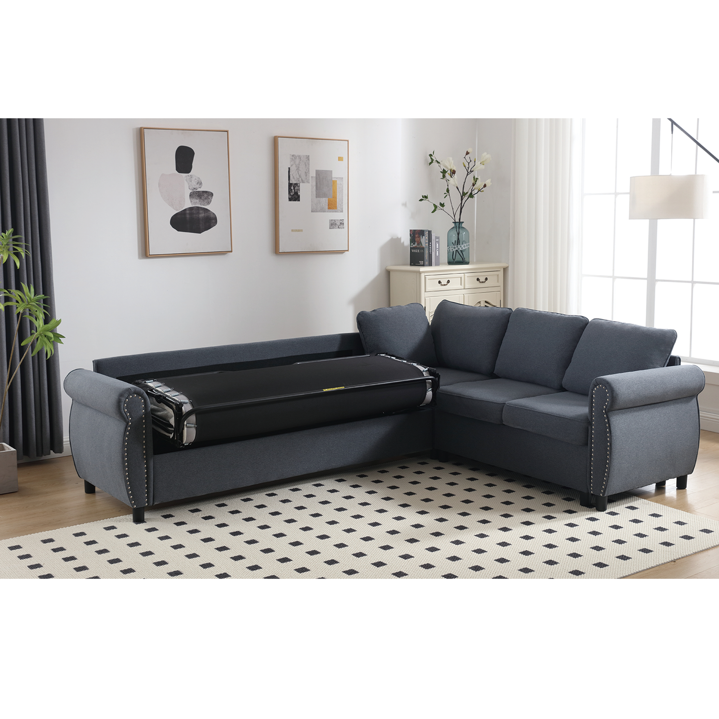 Dark blue fabric sectional sofa with pullout bed mechanism partially extended