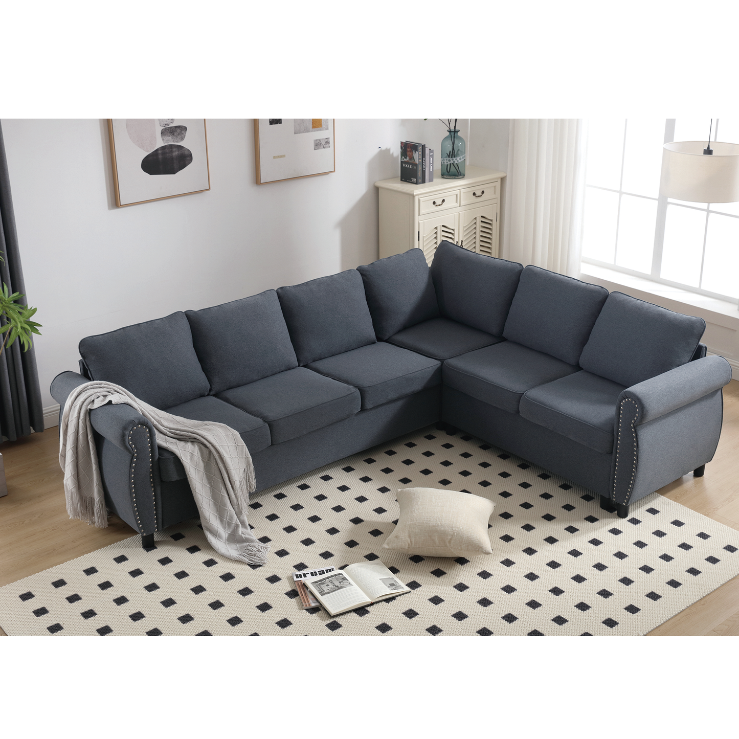 Dark gray linen Lshaped sectional sofa with studded armrests and tufted back cushions