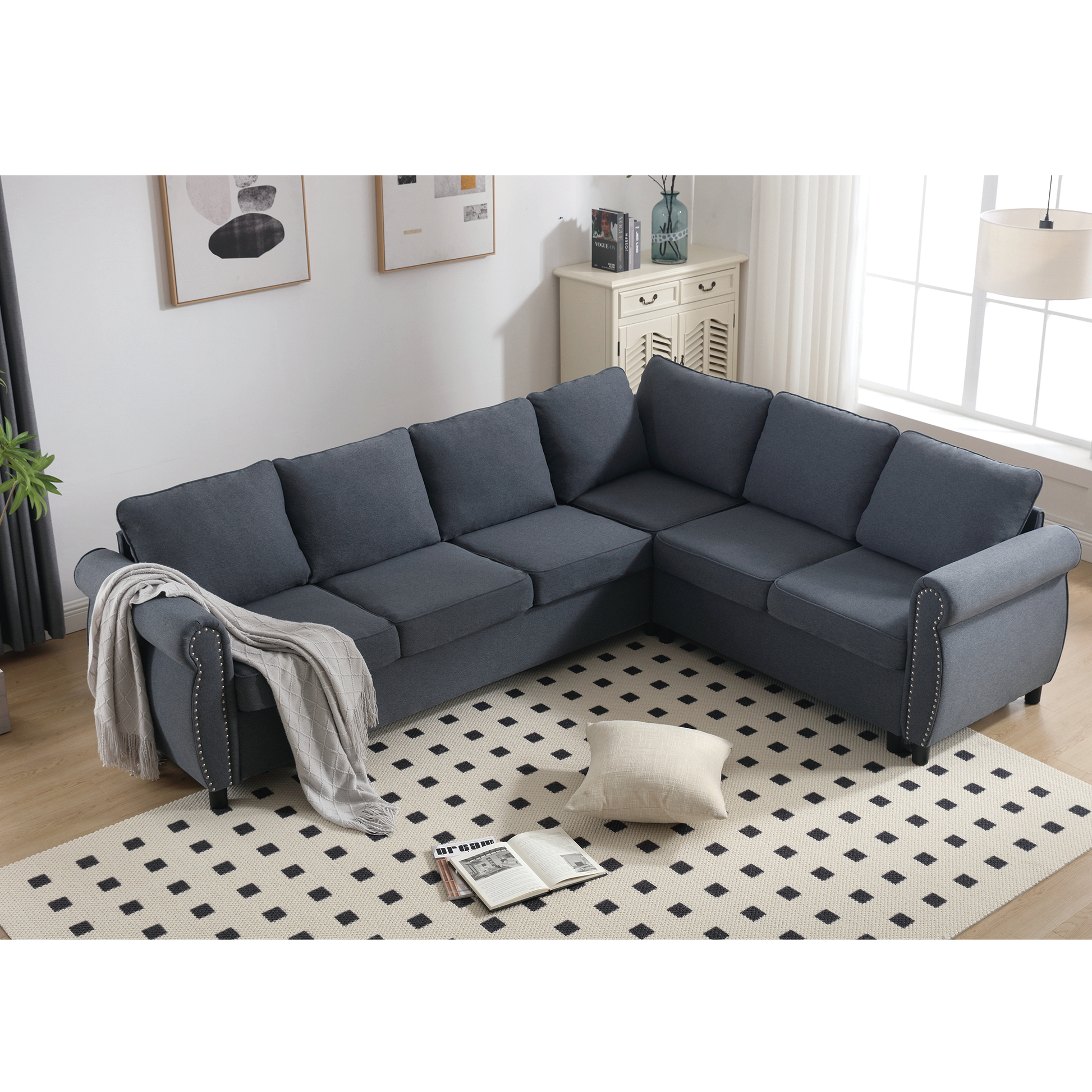 Dark gray linen Lshaped sectional sofa with studded armrests and tufted back cushions