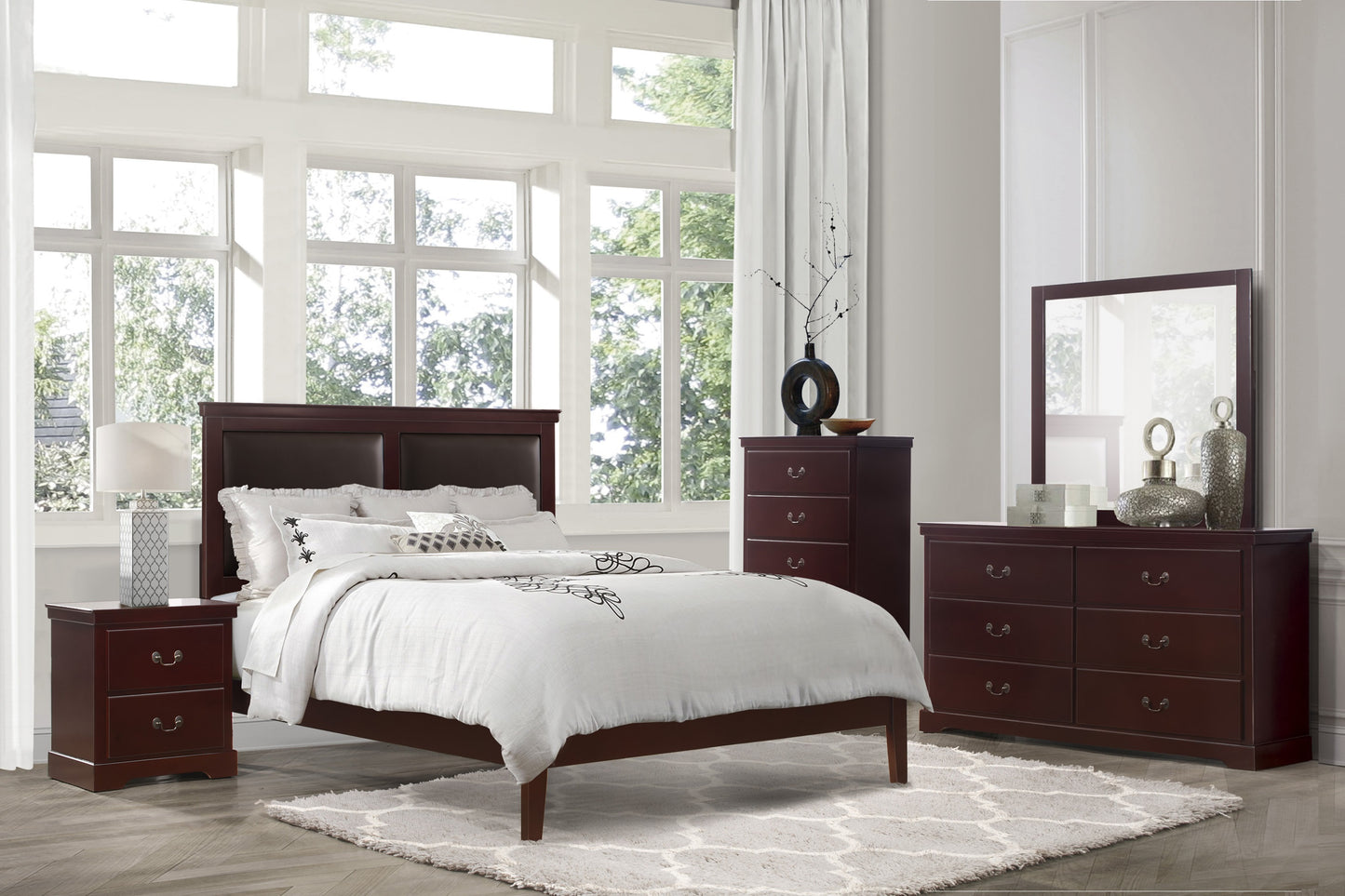Mahogany sleigh bed frame with white bedding and decorative pillows