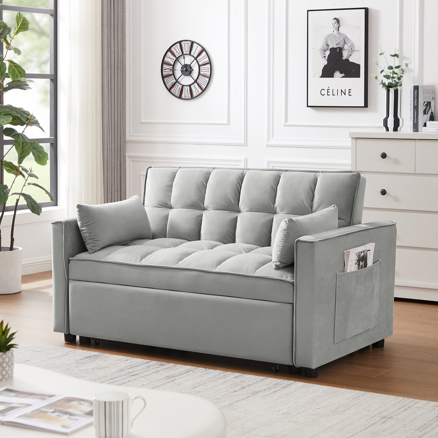 Light grey tufted sofa bed with convenient side pocket for magazines