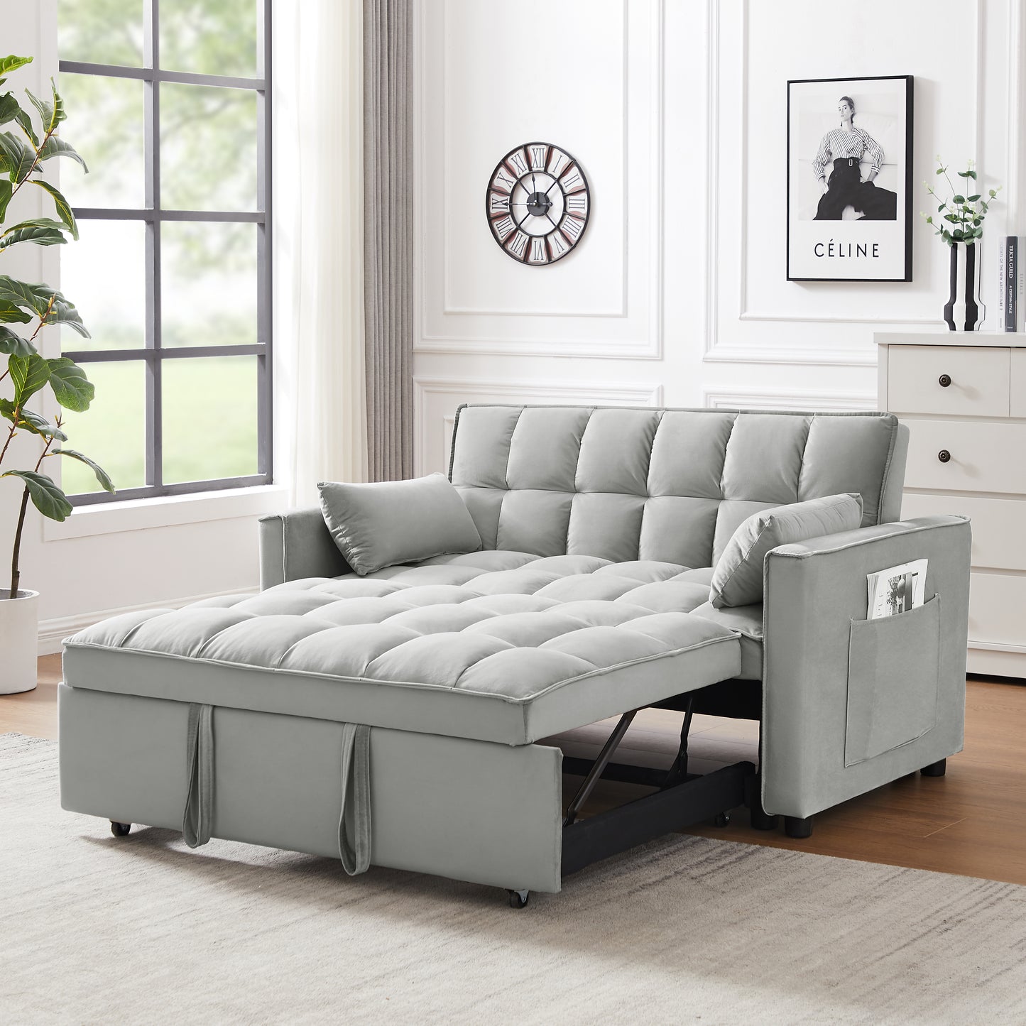 Gray velvet convertible sofa bed with tufted cushions and builtin storage pocket
