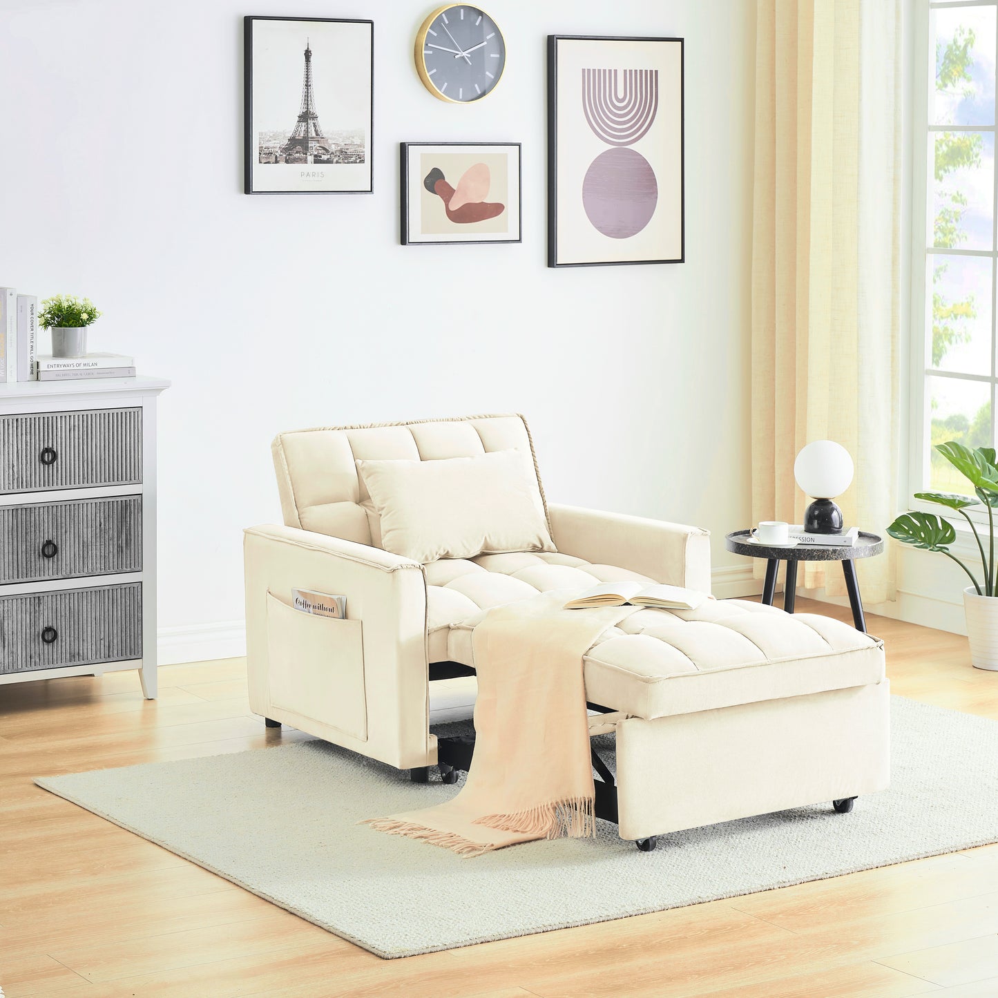 Cream upholstered convertible chair with ottoman a throw blanket and open book