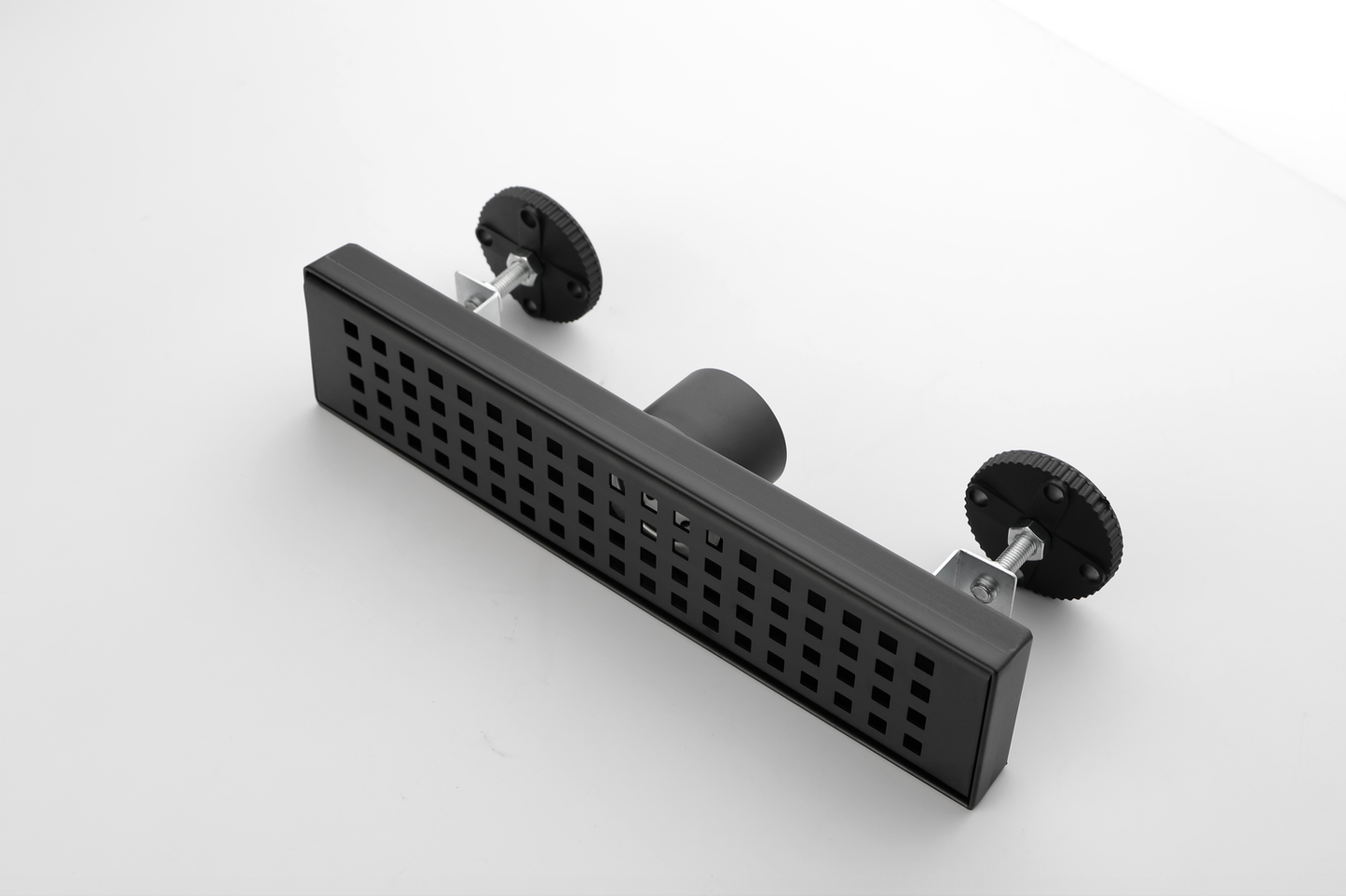 Black linear shower drain with adjustable feet and grate