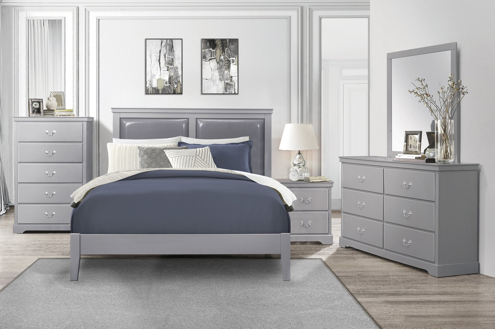 Gray upholstered headboard queen bed with navy bedding
