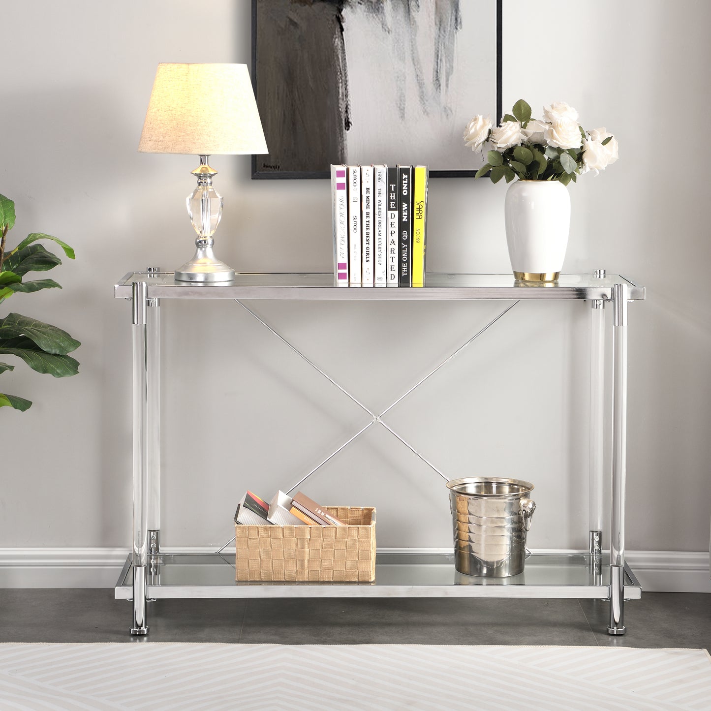 Sleek chrome and clear acrylic console table with glass shelves and Xframe support