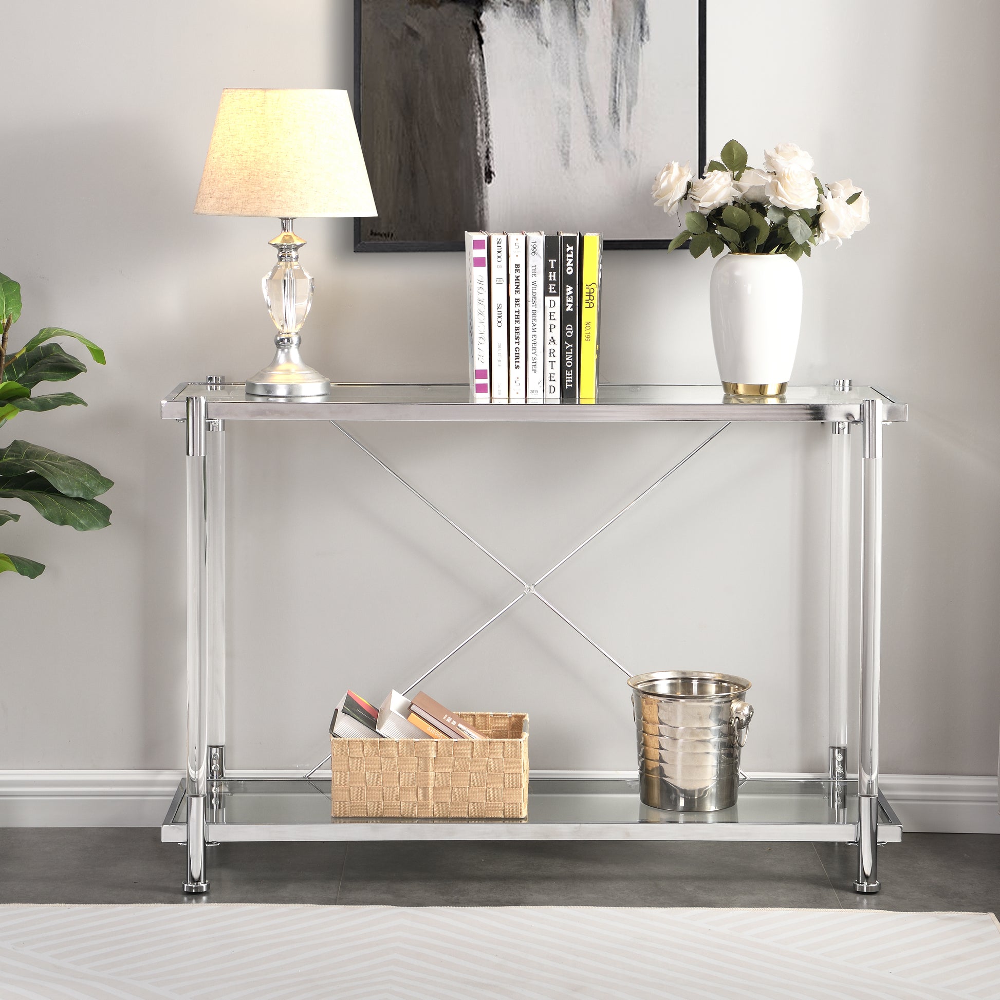 Sleek chrome and clear acrylic console table with glass shelves and Xframe support