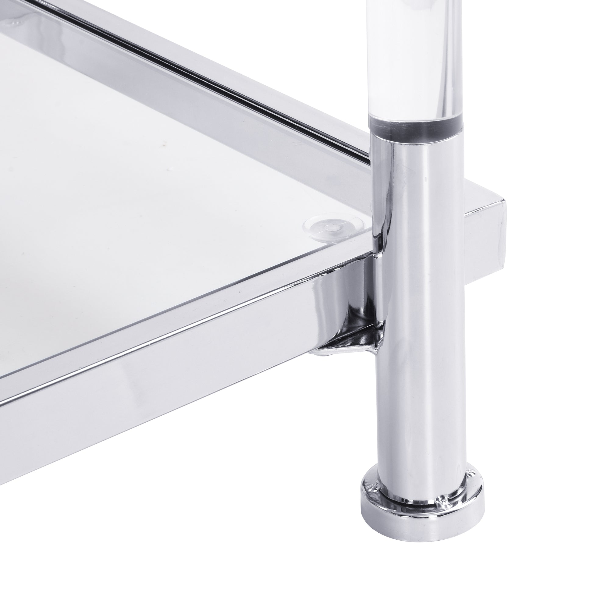 Closeup of a chrome metal shelf edge with a clear acrylic leg and a round base