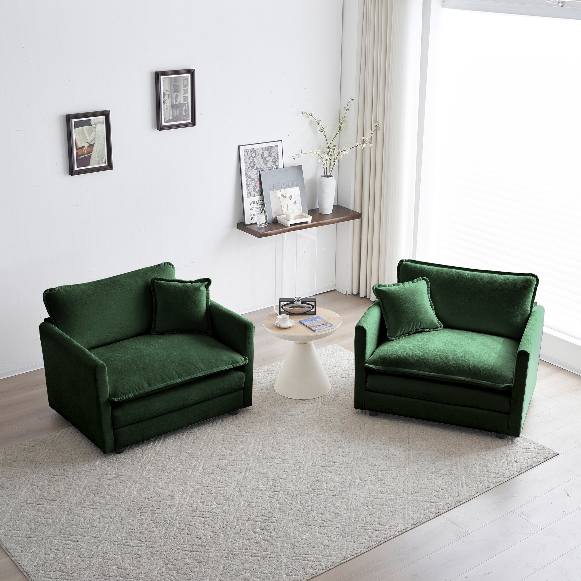 Plush emerald green velvet armchair with matching throw pillow