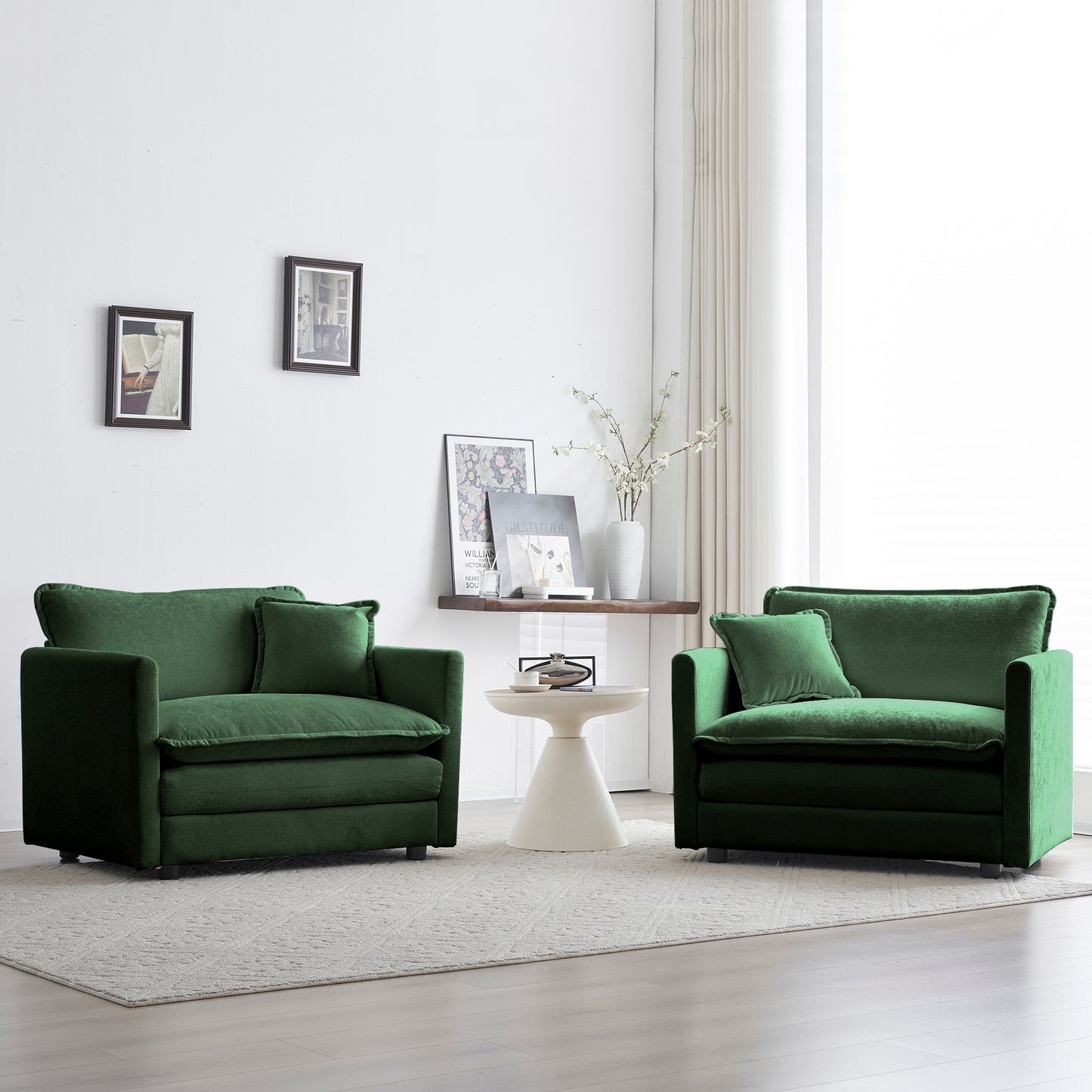 Plush emerald green velvet accent chair with a matching throw pillow for a cozy living room