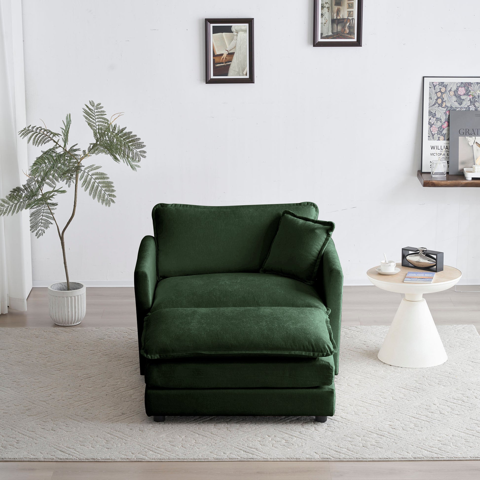 Emerald green velvet accent chair with plush cushions and an ottoman