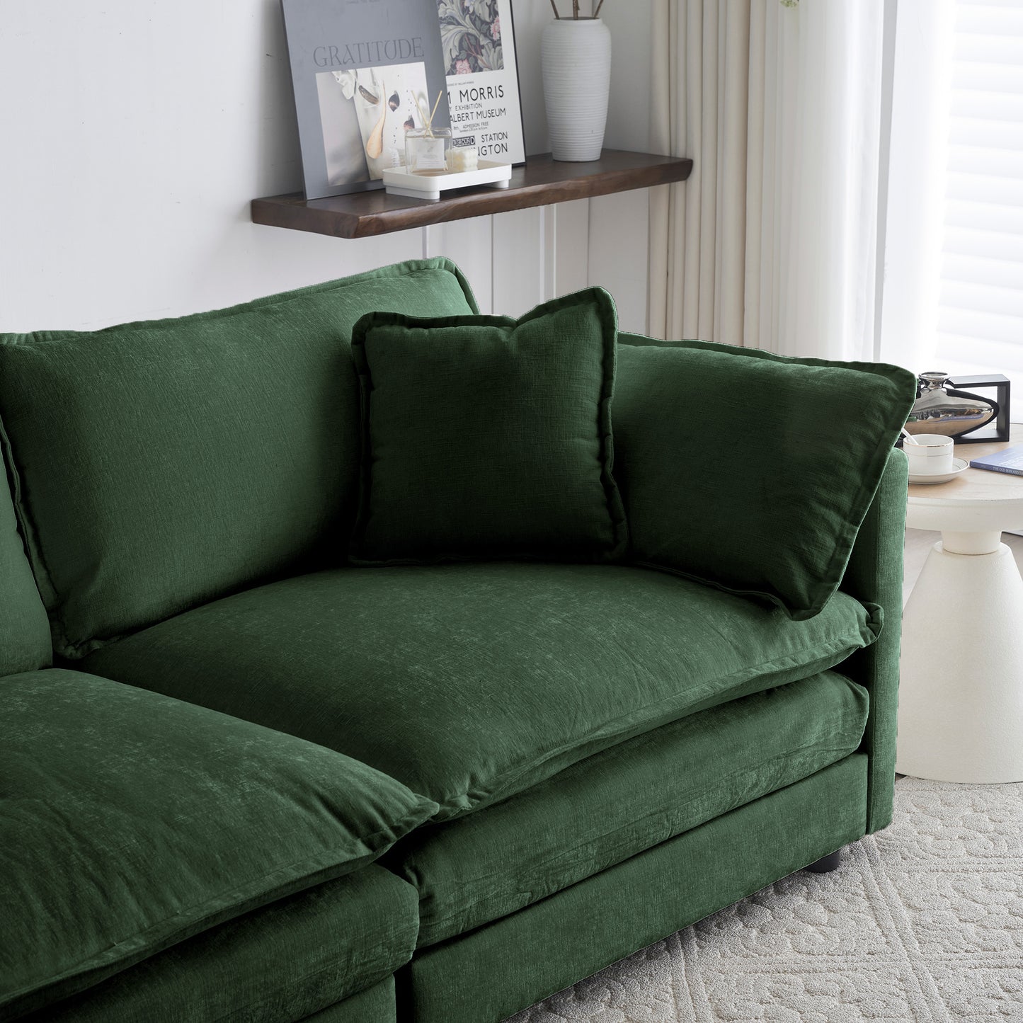 Deep green velvet sectional sofa with plush cushions for modern living room comfort
