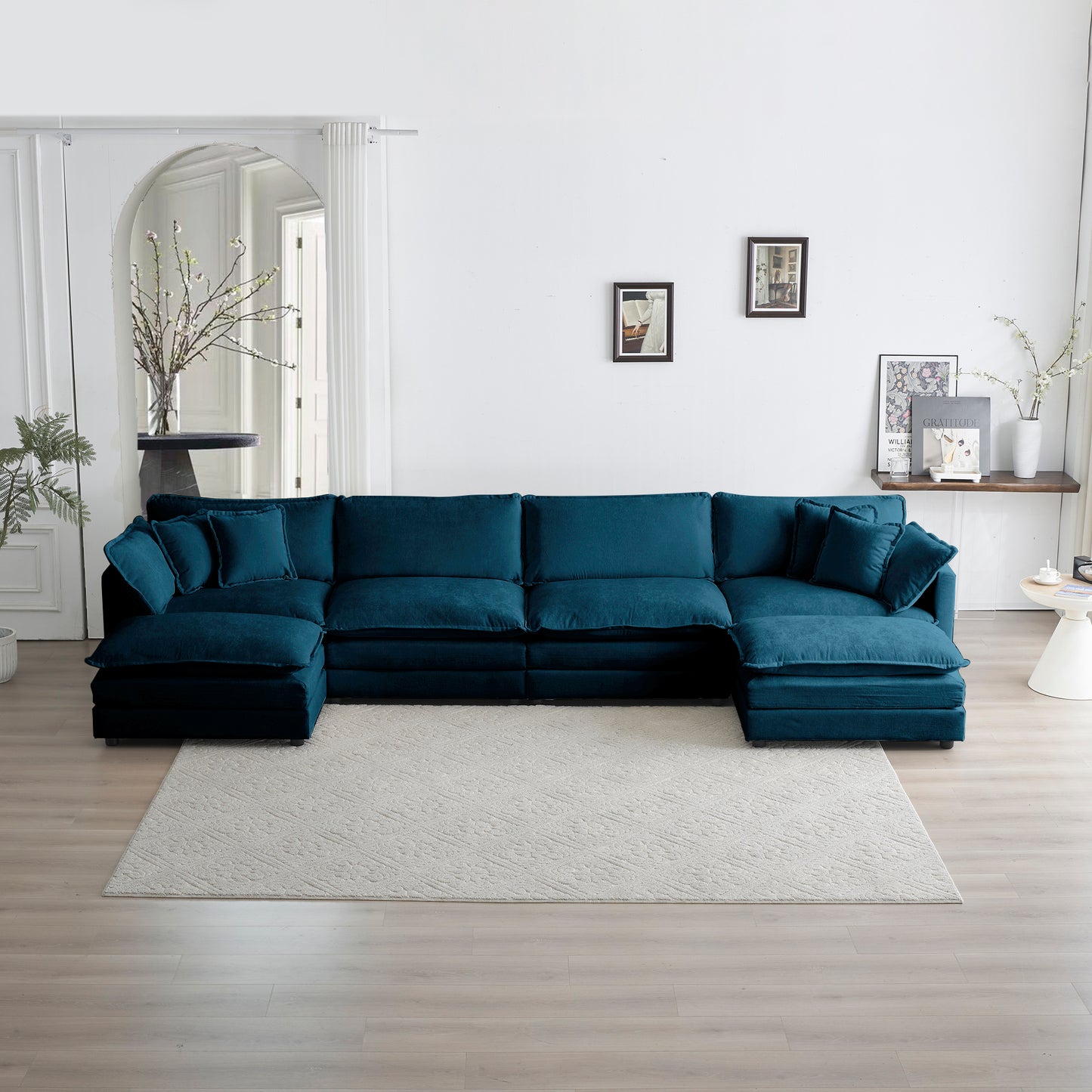 Deep teal velvet sectional sofa with plush cushions ideal for spacious living rooms
