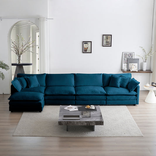 Plush teal velvet sectional sofa with matching throw pillows offering comfortable seating