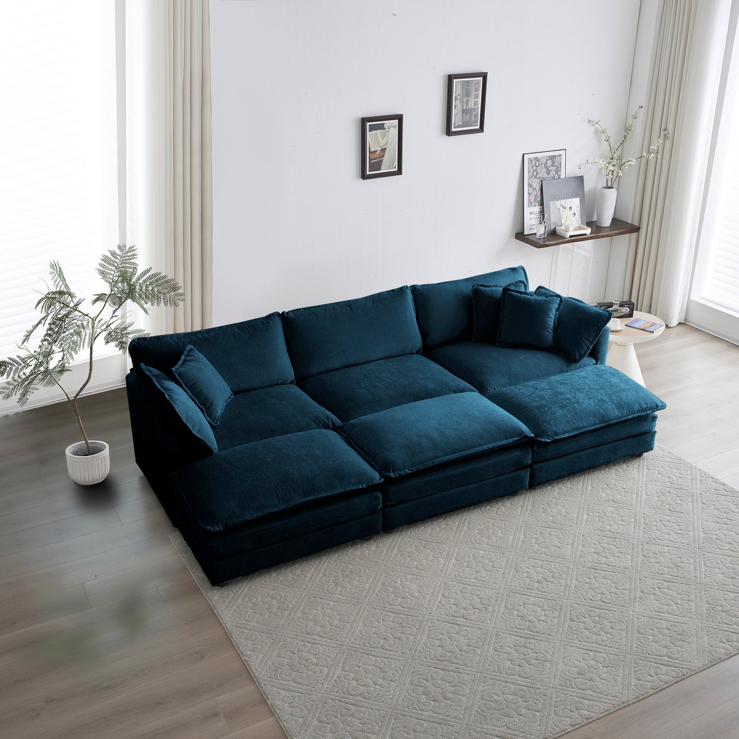 Deep teal velvet sectional sofa with plush cushions and chaise lounge ideal for modern living rooms