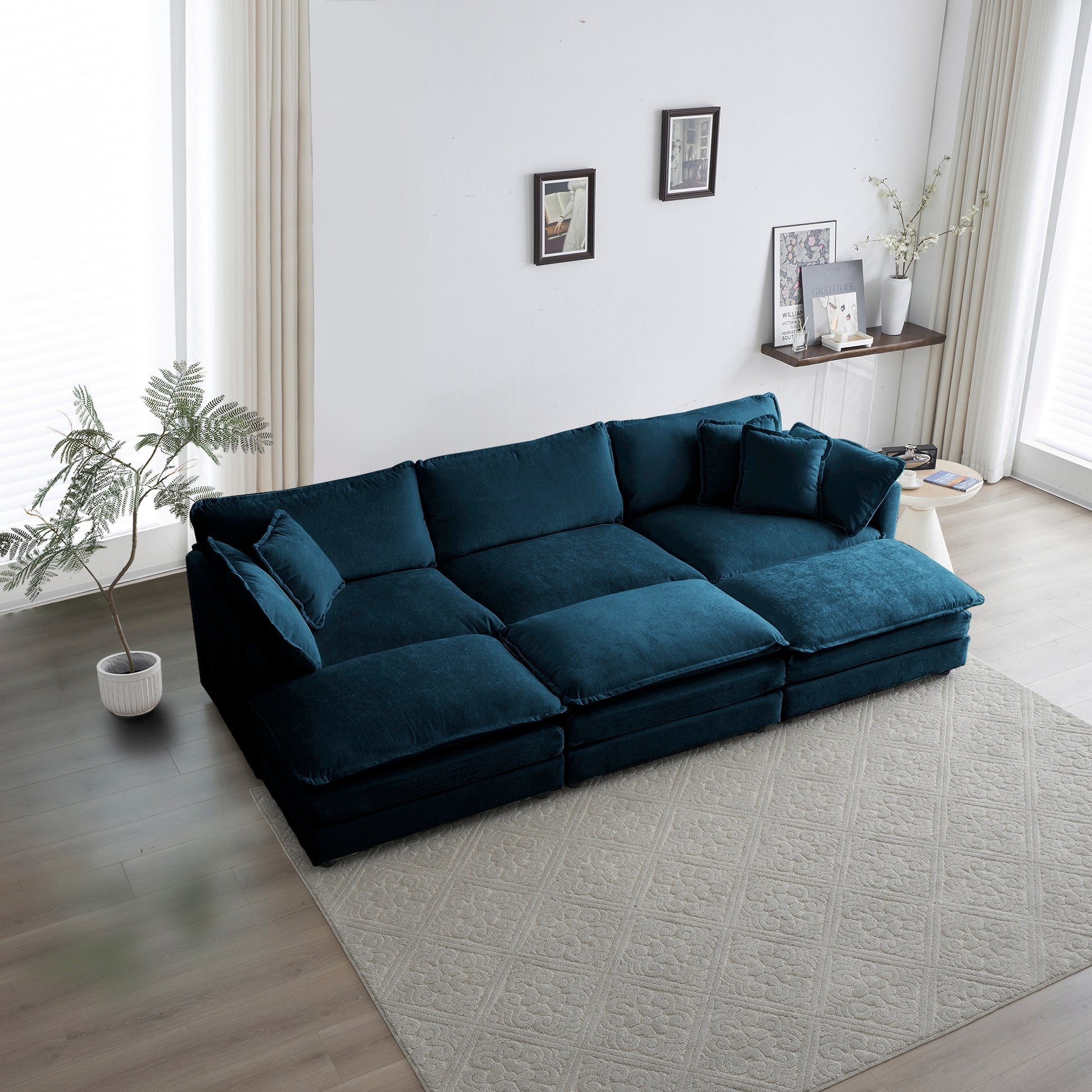 Deep teal velvet sectional sofa with plush cushions and chaise lounge ideal for modern living rooms