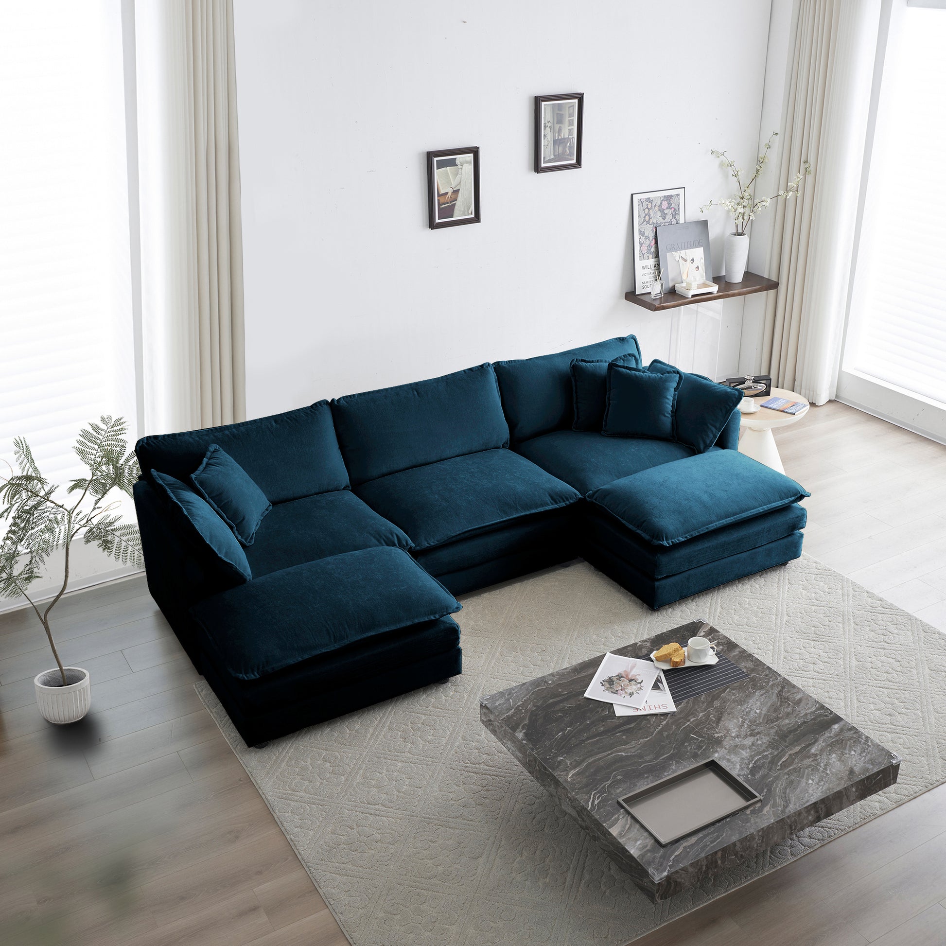 Deep teal velvet sectional sofa with plush cushions and chaise lounge