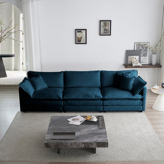 Deep teal velvet sectional sofa with plush cushions for comfortable seating