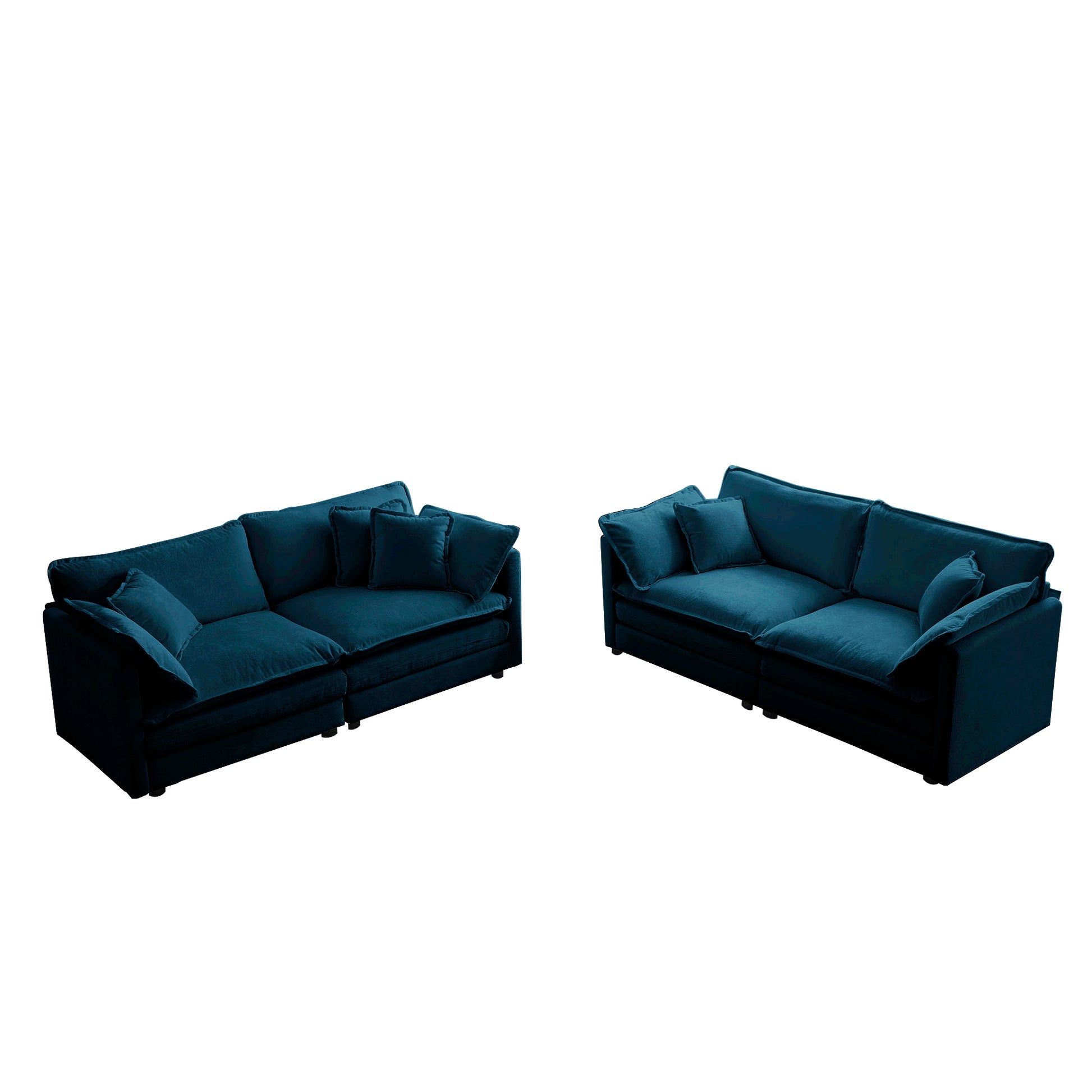 Two plush teal velvet sectionals with deep seating and accent pillows perfect for a modern living room